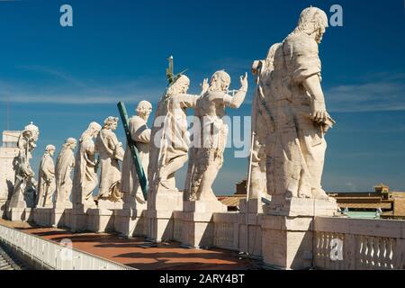 Statues of Christ and the apostles on the roof of St. Peter`s basilica, Vatican, Rome Stock Photo